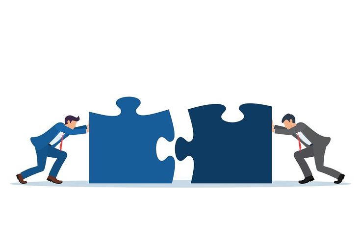 businessmen pushing two puzzle